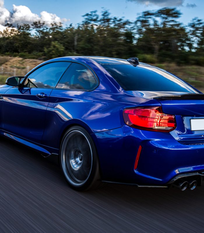 blue-car-driving-road